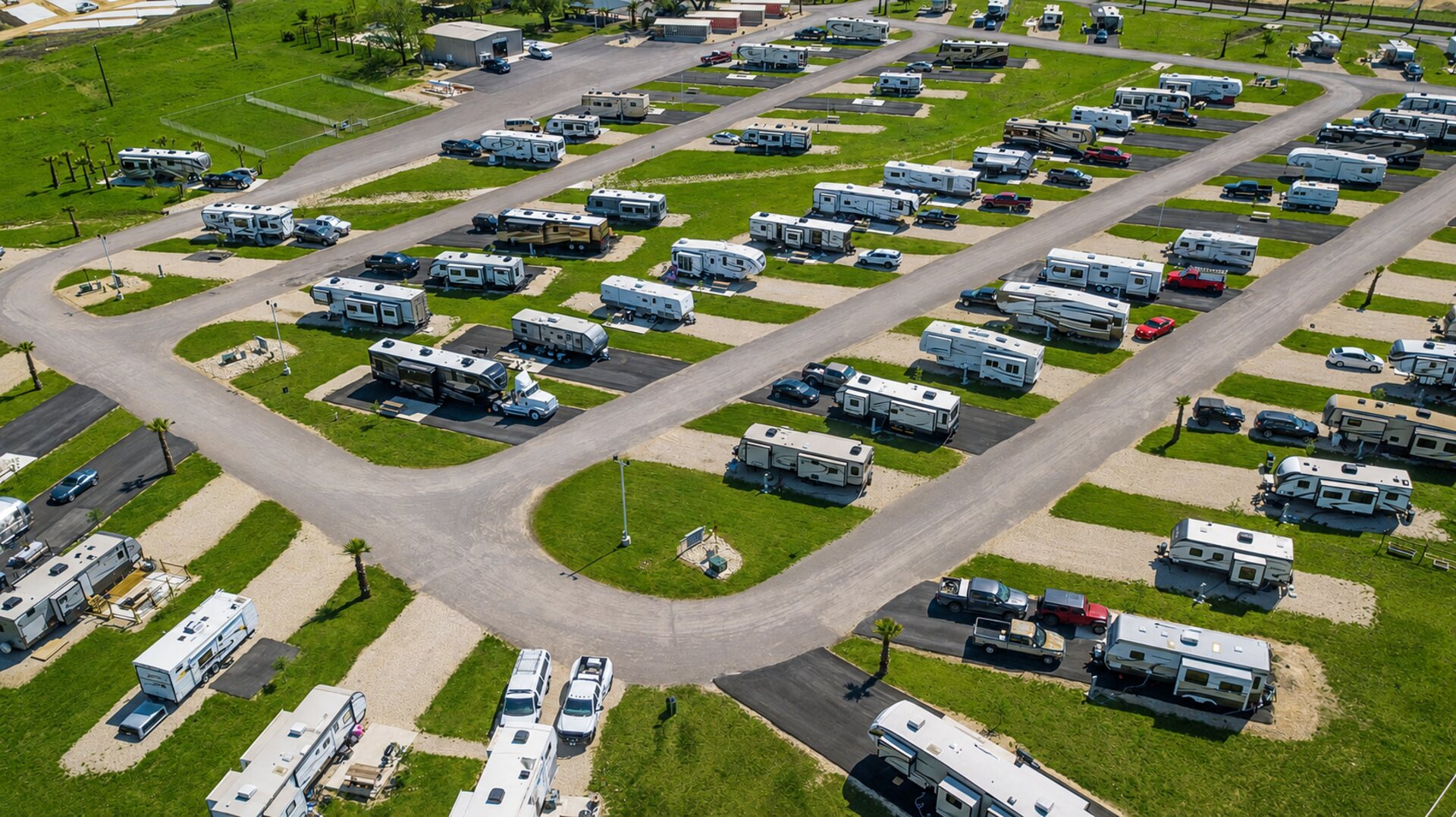 Aerial view of RV sites and green space at Rivercity RV Park